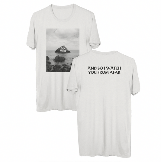 White Comfort Colors T-shirt by And So I Watch You From Afar features a black-and-white sea rock photo labeled DO MÓR on the front, "AND SO I WATCH YOU FROM AFAR" in bold on the back, and is made from soft ring-spun cotton for comfort.
