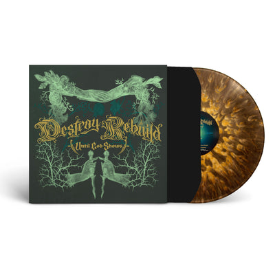 Album cover for destroy rebuild until god shows. The album cover is black and has green abstract imagery. the center of it says "destroy rebuild until god shows" in dark gold text. the album cover represented is for a vinyl sleeve, there is a clear with gold and black splatter vinyl sticking halfway out of the vinyl sleeve.