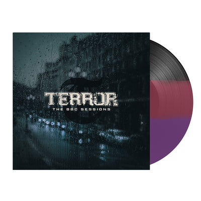  Image of terror- the bbc sessions vinyl sleeve with a tri color black, maroon, and purple vinyl against a white background. The terror artwork features a photo of a street with cars lined up against the side of the street. There is a large building next to where the cars are parked. there is rain all over the cover, like this was photographed from the inside of a window. the image is a blue/grey color. Across the front in white text reads terror- the bbc sessions.