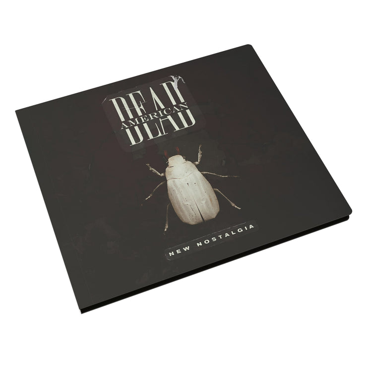  Image of a cd case against a white background. The case says Dead american on the top center of the sleeve. Below is a white insect that looks like a beetle. below that in small white text reads "new nostalgia".
