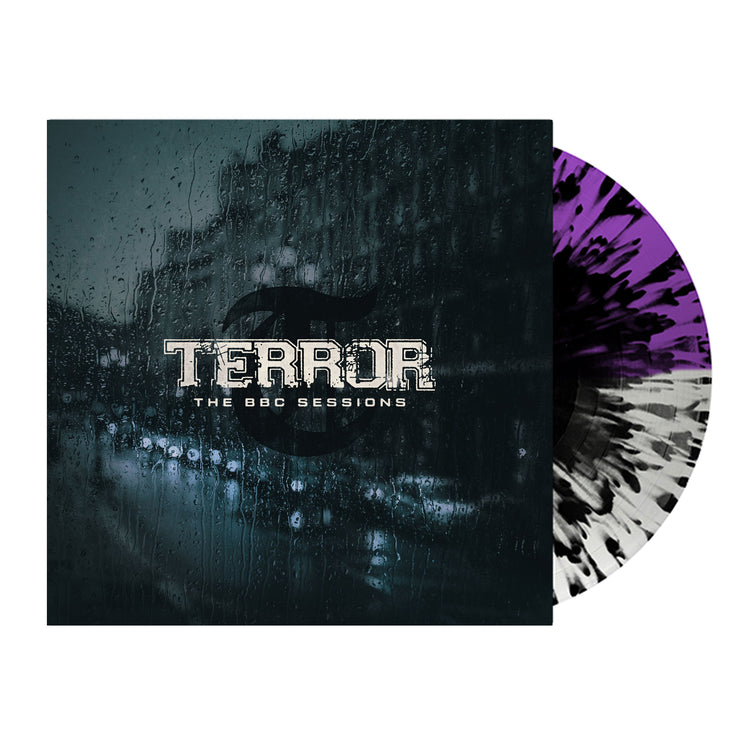 Image of terror- the bbc sessions vinyl sleeve with a half clear, half purple with black splatter vinyl against a white background. The terror artwork features a photo of a street with cars lined up against the side of the street. There is a large building next to where the cars are parked. there is rain all over the cover, like this was photographed from the inside of a window. the image is a blue/grey color. Across the front in white text reads terror- the bbc sessions.