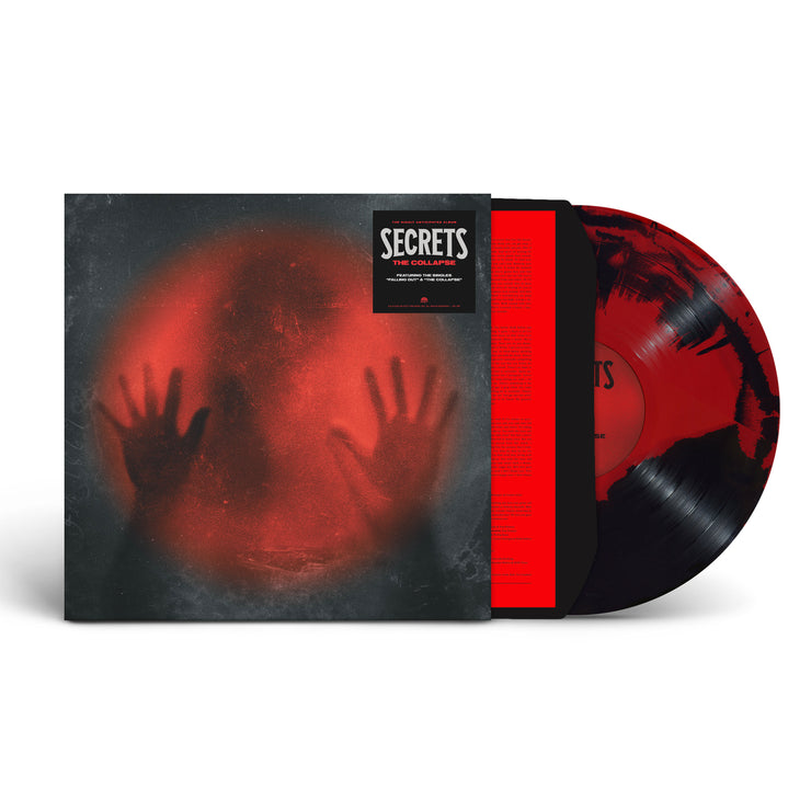 Image of Secrets- the collapse vinyl cover with a black and red mixed vinyl sticking halfway out of the sleeve. The album art features a black image with a red lit circle in the center. the silhouette of a head is in the middle, with two hands pressed up against the red light. the hype sticker in the right top corner reads "secrets, the collapse".