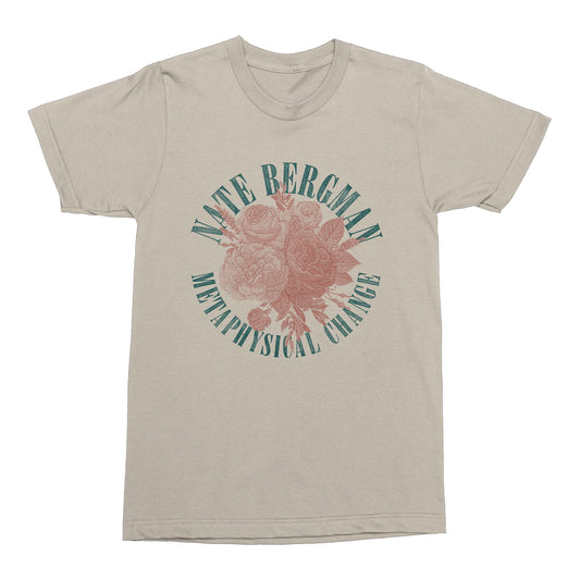 Tan tshirt against white background. In blue arching text reads nate bergman. below this is a red image of flowers. below this in an arch reads metaphysical change. this is in blue.