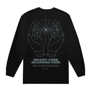   Image of the back of a black longsleeve against a white background. The back features a graphic of two hands with a circle symbol with lines going through it. Below this reads "scary kids scaring kids". There are lyrics below this and three small outlines of circles. This is all in a blue/grey color.