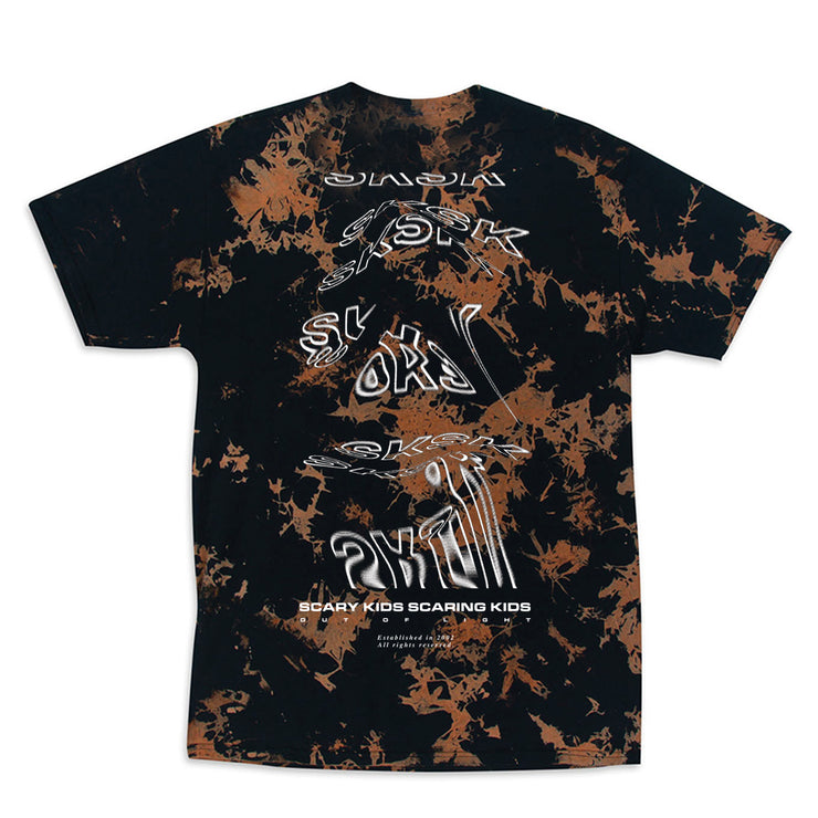 Image of the back of a black tshirt with a bleached tye die effect all over.  The left chest in white text says scary kids scaring kids, and SKSK below it. The back says SKSK in white outlined text a bunch of times, but is distorted and stretched for abstract effects. below this in white text reads "scary kids scaring kids". Below that reads "out of light".