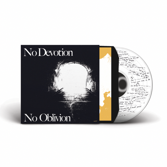 A partially open No Devotion CD case for “No Oblivion” reveals a disc with handwritten text. The black cover shows a white abstract archway, and limited edition signed lyric sheets are included.