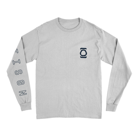  Image of the front of a white longsleeve. The left chest has a symbol that looks like two lines, with a circle in between them. the right sleeve says "jettison" in an outline black text. 
