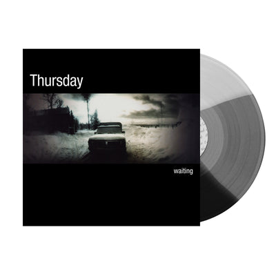 Image of the thursday waiting album artwork with a tri color clear, black and grey vinyl sticking out of the sleeve. The sleeve is black and says thursday, waiting in white text. the center of the album shows an old timey photo of a car sitting in the snow. The sky is cloudy.