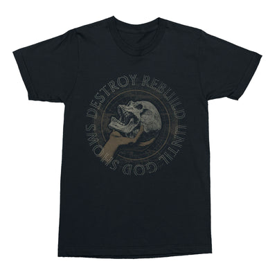 Black tshirt against white background. The center of the shirt has a graphic of a hand holding onto a skull head. Around that in a circular shaped text reads "destroy rebuild until god shows". this is in a faded white print.