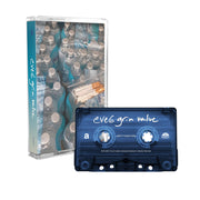 Cassette tape and cassette case against a white background. The tape is a clear blue and says eve 6 grim value in white text. the cassette case is an image of four cases of bottled water, with cigarettes in a clear plastic baggie sitting on top of one of the cases of water.