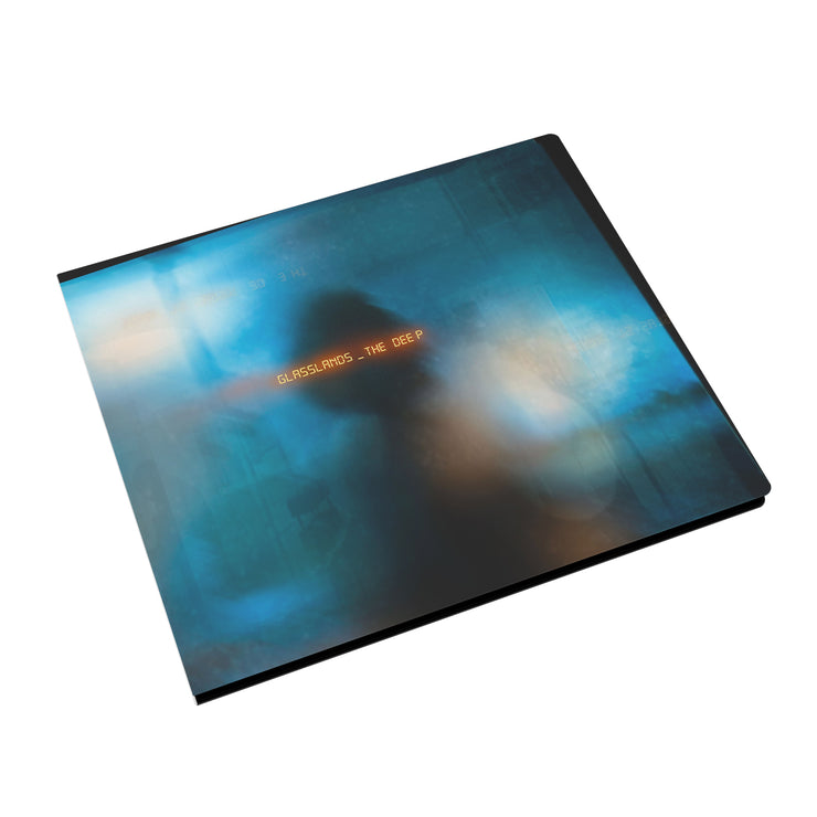 Image of a cd case against white background. The album artwork is a blurred blue and white color, and there is a faded silhouette of a person in the center. Across their head in an orange glowing analog text reads "glasslands, the deep".