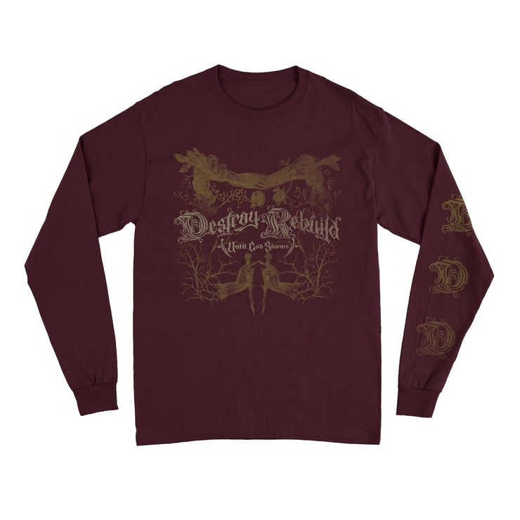 Image of a maroon long sleeve against a white background. The front in a dark faded gold has abstract art with the words destroy rebuilld until god shows. The left sleeve has a swirly letter D going down the sleeve multiple times.