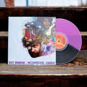 Image of a vinyl sleeve and a half violet, half black colored vinyl against a dark colored concrete style background. The album art is white and features a colored graphic of a person's head with flowers, a car, doors, people, and road signs around it. Below this in colorful text reads "nate bergman, metaphysical change".